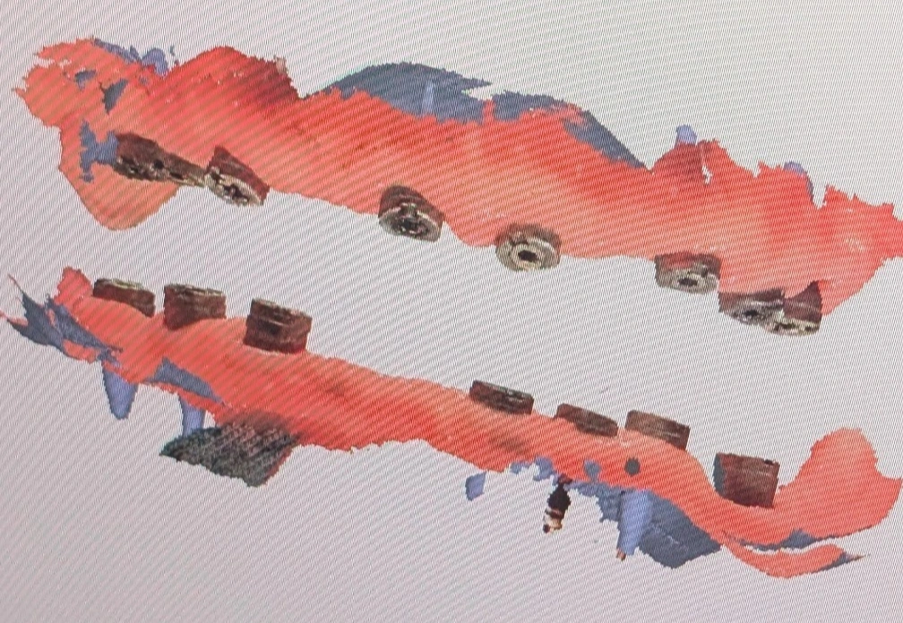 Digital full-arch scan of a fully edentulous patient on the monitor, showing the relationship of the upper and lower ridges used as a visual cue for vertical dimension